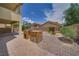 A backyard with patio, desert landscaping, and outdoor kitchen at 9792 Crescent Lodge Ct, Las Vegas, NV 89178