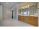 Bathroom with double sinks, shower, and tile flooring at 9792 Crescent Lodge Ct, Las Vegas, NV 89178