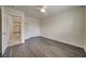 Bedroom with wood-look floors and double door closet at 9792 Crescent Lodge Ct, Las Vegas, NV 89178
