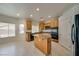 Well-equipped kitchen with granite countertops, maple cabinets, stainless appliances, and modern fixtures at 9792 Crescent Lodge Ct, Las Vegas, NV 89178