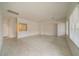 Open floor plan with neutral paint, tile floors, archway detail and natural light at 9792 Crescent Lodge Ct, Las Vegas, NV 89178