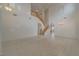 Bright and spacious living room featuring wood flooring, high ceilings, staircase, and lots of natural light at 9792 Crescent Lodge Ct, Las Vegas, NV 89178