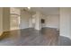 Open-concept living room with hardwood flooring, recessed lighting, and neutral paint at 9792 Crescent Lodge Ct, Las Vegas, NV 89178