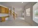 Bright living room featuring tile flooring, large windows, and staircase at 9792 Crescent Lodge Ct, Las Vegas, NV 89178