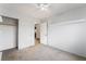 Spacious bedroom featuring neutral carpet, a ceiling fan, and bright white trim and walls at 9962 Keephills St, Las Vegas, NV 89183