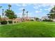 Expansive green space with well-maintained lawn, walking path, and community amenities, perfect for recreation at 9962 Keephills St, Las Vegas, NV 89183