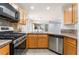 A well-equipped kitchen with stainless steel appliances and ample counter space at 9962 Keephills St, Las Vegas, NV 89183