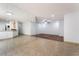 Spacious open-concept living area with tile and carpet floors, adjoining the kitchen at 9962 Keephills St, Las Vegas, NV 89183