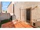 Private patio with sliding door, tile floor, block wall, and turf area, ideal for relaxing outdoors at 9962 Keephills St, Las Vegas, NV 89183