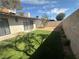 Backyard space with fresh green turf, foliage, and the home's sliding glass doors at , Las Vegas, NV 89121