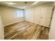 Bright bedroom featuring hard surface floors, closet doors, and fresh paint at , Las Vegas, NV 89121