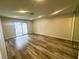 Bonus room with sliding glass doors providing access to yard and new wood-look floors at , Las Vegas, NV 89121