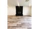 Living room boasts stone fireplace with wood floors and fresh paint at , Las Vegas, NV 89121