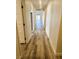 Hallway with hard surface flooring and doors leading to various rooms at , Las Vegas, NV 89121