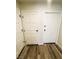 Hallway features wood-look floors, storage closet, and a white door to the right at , Las Vegas, NV 89121