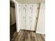Hallway showing storage closets with fresh paint and new wood floors at , Las Vegas, NV 89121