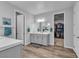 Elegant bathroom with double sinks, quartz countertop, and a large mirror at 10300 Stroma Ave, Las Vegas, NV 89166