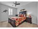 Cozy bedroom with a queen bed, shutters, ceiling fan, and matching nightstands at 10300 Stroma Ave, Las Vegas, NV 89166