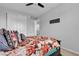 Comfortable bedroom with closet and queen bed with decorative pillows and floral bedding at 10300 Stroma Ave, Las Vegas, NV 89166