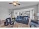 Bright and airy living room flows into a modern kitchen, showcasing an open-concept design and stylish decor at 10300 Stroma Ave, Las Vegas, NV 89166