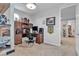 Office room featuring custom desk, decor, and access to a bathroom at 10300 Stroma Ave, Las Vegas, NV 89166