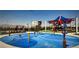 Fun splash pad area with various water features and shaded seating for families to enjoy at 10300 Stroma Ave, Las Vegas, NV 89166
