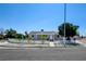 Charming single-story home with a white picket fence and freshly painted exterior at 1123 Chapman Dr, Las Vegas, NV 89104