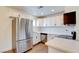 Modern kitchen with stainless steel appliances, white cabinetry, and ample countertop space at 1123 Chapman Dr, Las Vegas, NV 89104