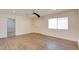 Bright living room featuring laminate flooring, natural light, and a ceiling fan at 1123 Chapman Dr, Las Vegas, NV 89104