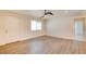 Spacious living room with laminate flooring, natural light, and neutral paint colors at 1123 Chapman Dr, Las Vegas, NV 89104