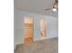 Bright main bedroom with neutral carpet, ceiling fan, walk-in closet and bathroom with shower at 1123 Chapman Dr, Las Vegas, NV 89104