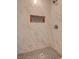 Walk in shower with marble tiling, and hexagon tile niche at 1123 Chapman Dr, Las Vegas, NV 89104