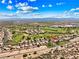 An aerial shot of a golf course community, desert landscaping and mountain views at 1131 Golf Club, Laughlin, NV 89029
