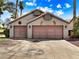 Two car garage in front of palm trees at 1131 Golf Club, Laughlin, NV 89029