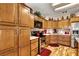 Well-equipped kitchen featuring stainless steel appliances and custom wood cabinetry at 1131 Golf Club, Laughlin, NV 89029