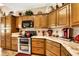 Traditional style kitchen with modern appliances, breakfast nook, and ample storage at 1131 Golf Club, Laughlin, NV 89029