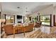Bright and open living room with a fireplace, vaulted ceiling, and access to the backyard at 1131 Golf Club, Laughlin, NV 89029