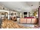 A spacious living room featuring wood laminate flooring, a fireplace, and plenty of natural light at 1131 Golf Club, Laughlin, NV 89029