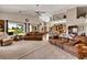 Bright open living room with high ceilings, plush sofas, and natural light from large windows at 1131 Golf Club, Laughlin, NV 89029