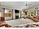 Bright living room with vaulted ceilings, fireplace, and natural light from large windows at 1131 Golf Club, Laughlin, NV 89029