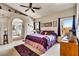 Inviting main bedroom with an arched entry to the main bathroom at 1131 Golf Club, Laughlin, NV 89029