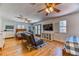 Spacious bedroom featuring two beds, hardwood floors, and an entertainment area at 1235 Panini Dr, Henderson, NV 89052