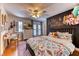 Charming bedroom with a chalkboard wall, a ceiling fan, and a sunny desk area at 1235 Panini Dr, Henderson, NV 89052
