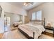 Cozy bedroom boasting mirrored closet doors and a neutral color palette at 1235 Panini Dr, Henderson, NV 89052