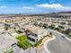 A high angle aerial showing a home with a well landscaped backyard and patio in a desirable suburban neighborhood at 12426 Alpenglow Ct, Las Vegas, NV 89138