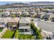 An aerial view of a home highlighting the outdoor patio and landscaping, set in a neighborhood with mountain views at 12426 Alpenglow Ct, Las Vegas, NV 89138
