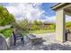 This backyard features a paved patio, an outdoor kitchen, and desert landscaping at 12426 Alpenglow Ct, Las Vegas, NV 89138
