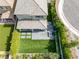 Aerial view of a backyard with a neat lawn, patio seating, and a fire pit area, perfect for outdoor gatherings at 12426 Alpenglow Ct, Las Vegas, NV 89138