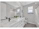 Bright bathroom featuring dual sinks and natural light at 12426 Alpenglow Ct, Las Vegas, NV 89138