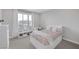 This bedroom features a large window with natural light and a storage bed frame at 12426 Alpenglow Ct, Las Vegas, NV 89138